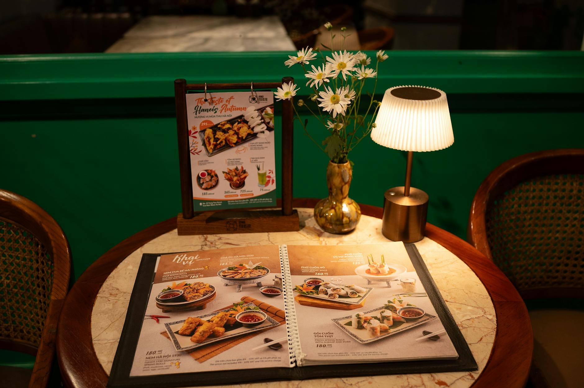Restaurant menu and staff training materials on a table.